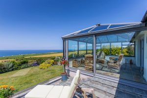 Modern extension with patio and balustrade in Tintagel